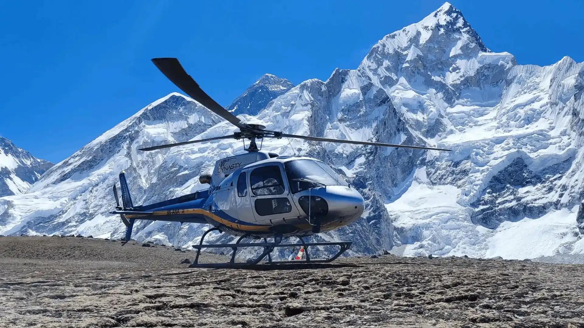 Private Everest helicopter charter flying over the snowcapped peaks of the Everest region
