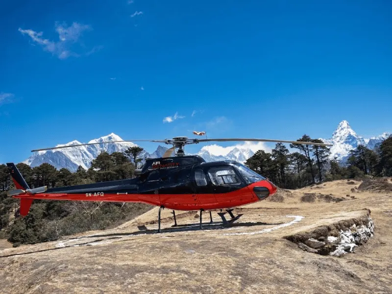 Private luxury helicopter charter flying over the Everest range